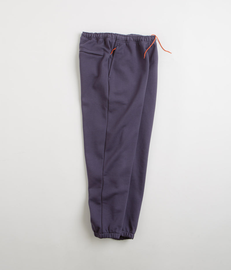 Nike ACG Tuff Fleece Lungs Pants in Dark Raisin and Safety Orange / Summit White