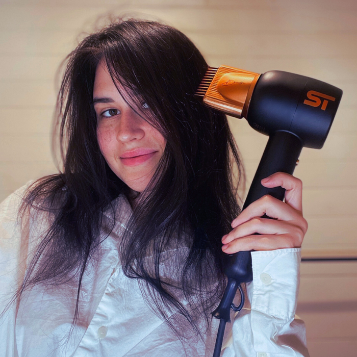Supreme Tools Black Hair Dryer in Use for Fast Drying and Professional Hair Styling